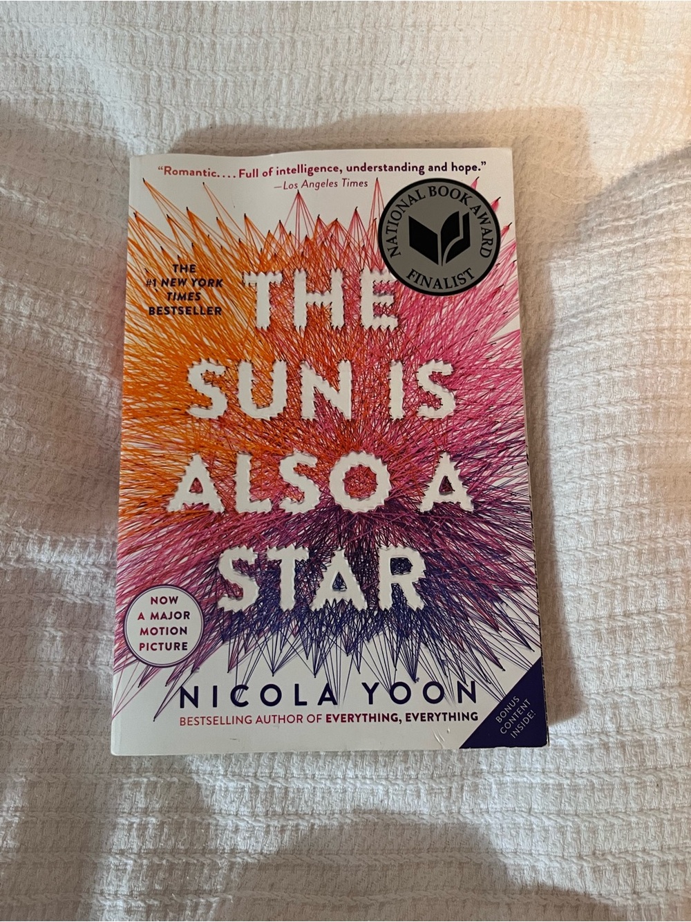 NICOLA Paperback Book with Vibrant Orange, Pink, Purple and Blue Cover